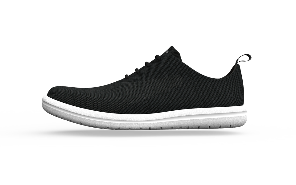 Wide classic black sneakers by Biopods, side view showing comfortable fit and stylish design.
