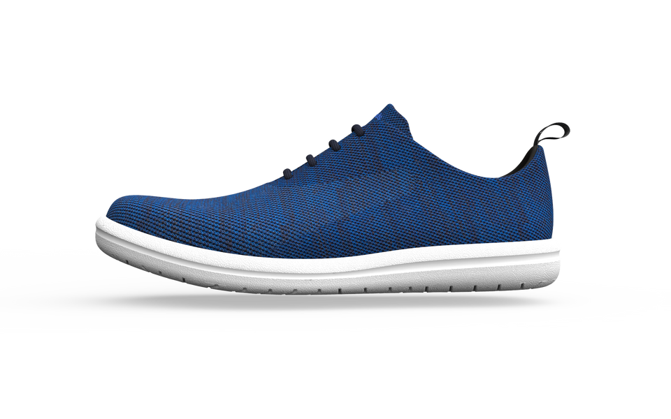 Wide classic sneakers by Biopods in sapphire blue, shown from a side view with white laces and sole detailing.