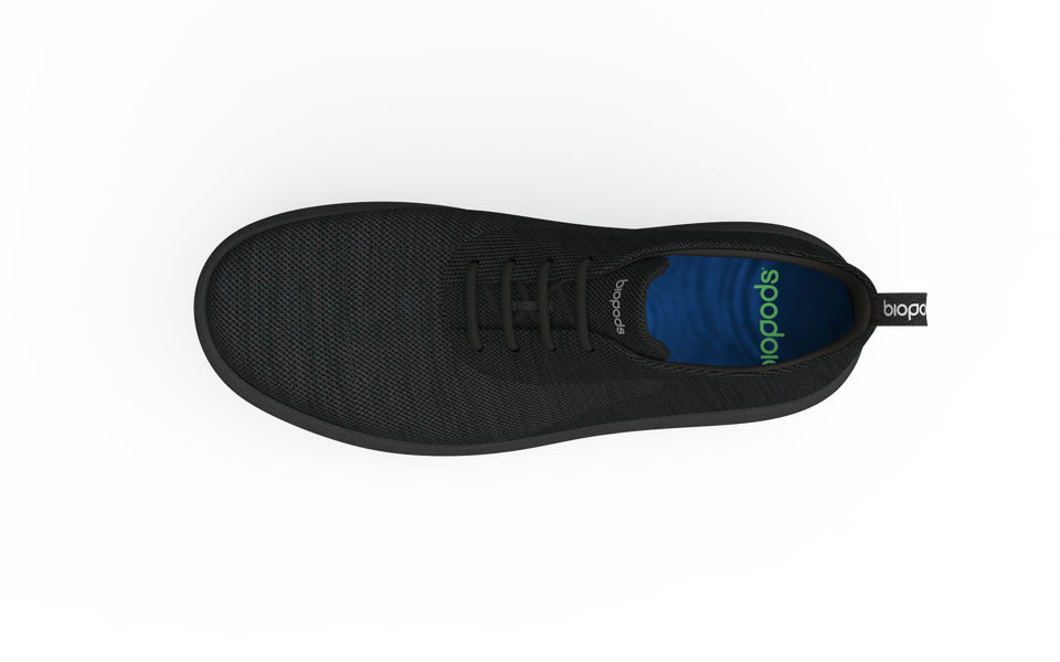 Black Biopods classic sneakers with white soles and laces, featuring a sleek, timeless design for casual wear.