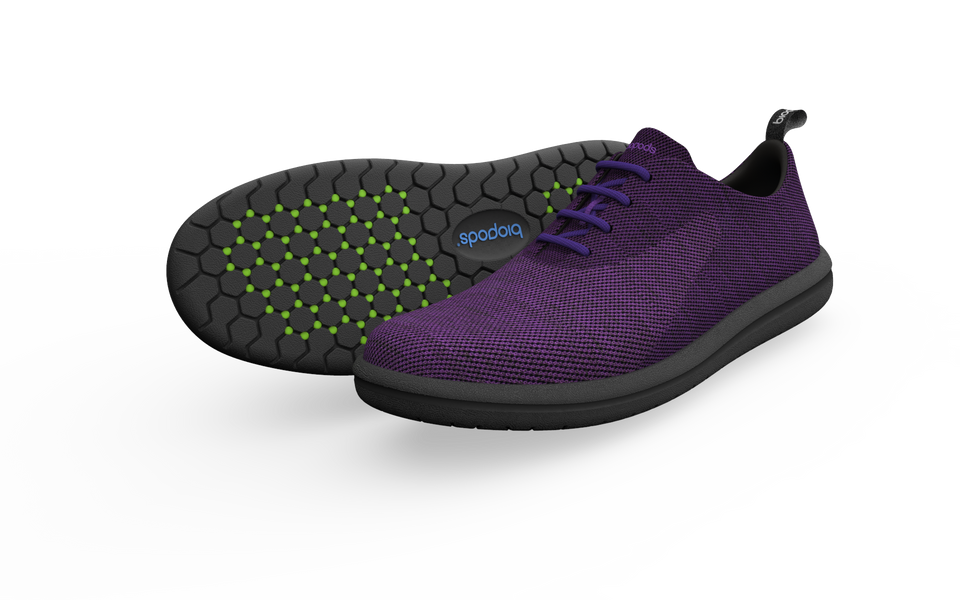 Pair of Biopods Classic Sneakers in amethyst with a side profile view showing their stylish design and color.