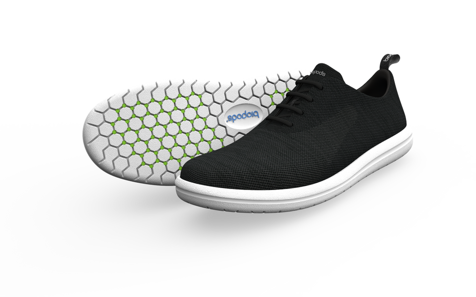 Pair of black Biopods narrow classic sneakers shown from the side with a subtle drop shadow.