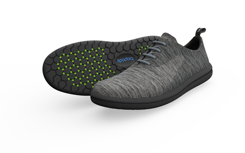 Pair of grey Biopods Classic Sneakers with a side profile view, showcasing the timeless design and comfortable fit.