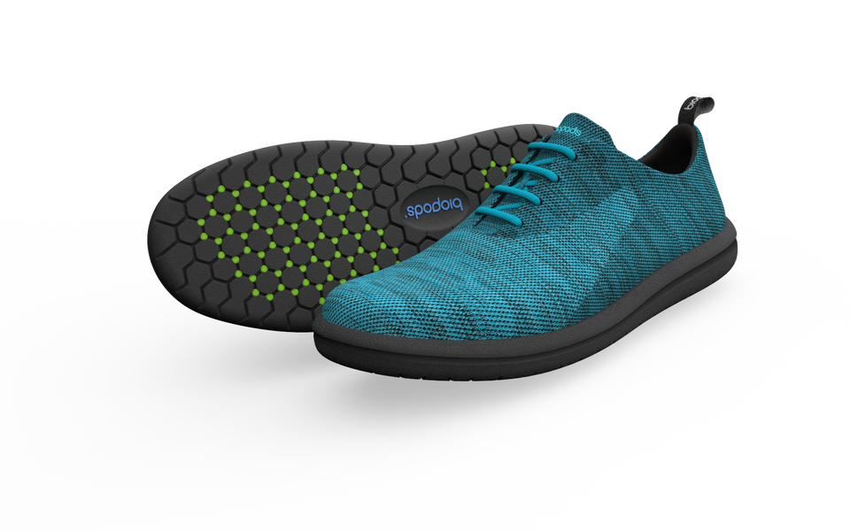 Pair of Biopods Classic Sneakers in ocean blue with white soles, shown from a side profile on a neutral background.