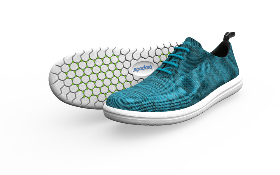 Pair of Biopods Classic Sneakers in ocean blue, showing side profile with white soles and laces.
