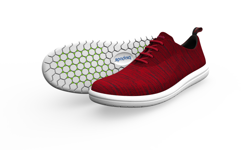 Pair of Biopods wide classic sneakers in vibrant red, showing side profile with white soles and laced design.