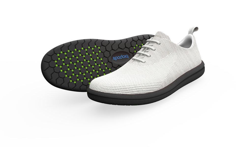 Pair of white Biopods classic sneakers with a side profile view, showcasing their clean design and standard fit.