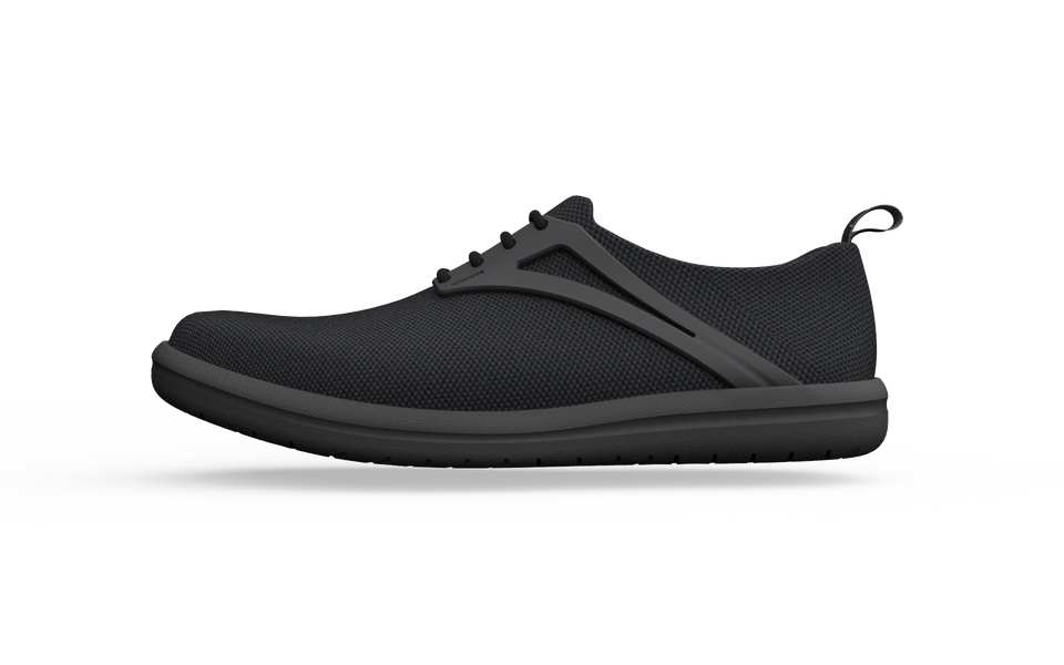 Black Biopods Urban Flex Sneakers with wide fit, side view showing sleek design and textured sole for comfortable urban style.