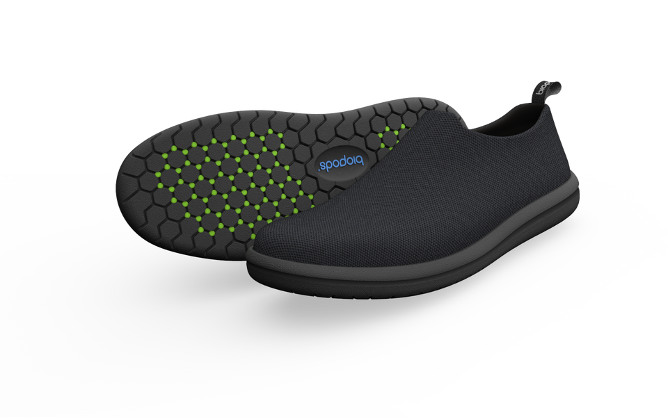 Wide black urban sneakers by Biopods with a sleek design and drop shadow, ideal for casual streetwear and everyday wear.