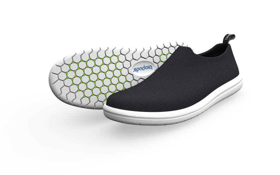 Black Biopods Urban Sneakers displayed from a side view with a shadow, showcasing their sleek urban sneaker design.