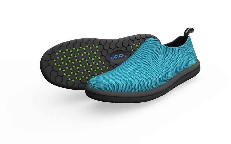 Wide Ocean Urban Sneakers by Biopods with a side view showing navy blue shoes with white soles and urban style design.