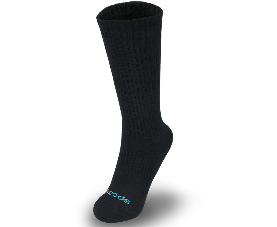 Black medium-length Biopods bamboo athletic socks displayed on a model's feet, highlighting their comfortable fit and breathable fabric.